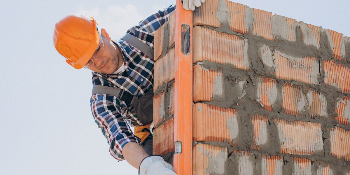 Construction worker brick wall photo