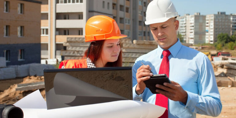 Photo of two construction employees having a conversation