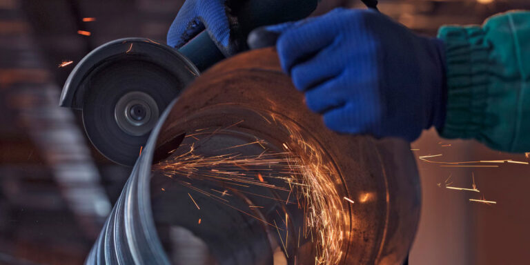 Photo of a worker using a tool