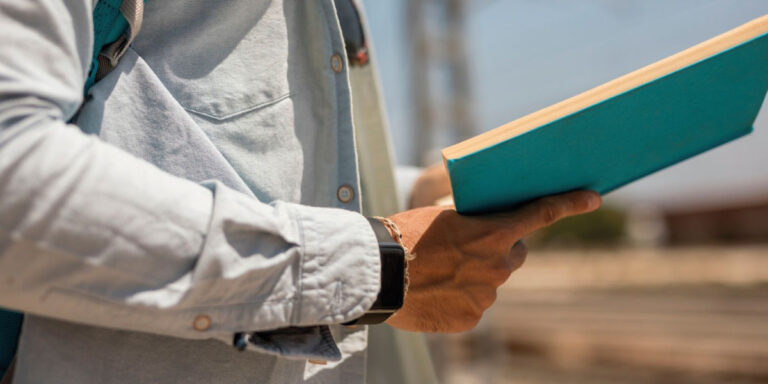 Photo of a man reading a book