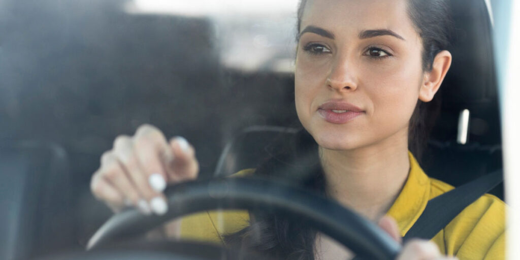 Photo of a woman driving her car