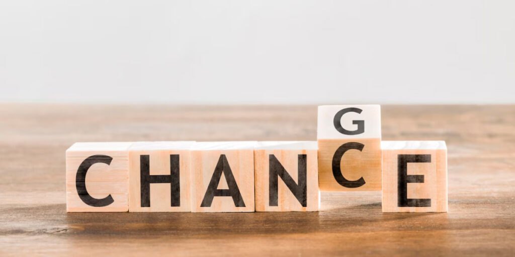 Photo of 6 blocks with letters on spelling out 'chance' the C block has a G on one side and the block is turning to spell 'change'