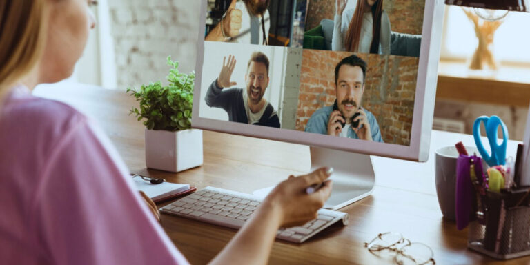 Photo of a worker on a zoom call with colleagues