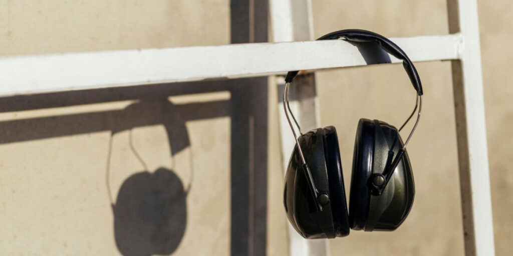 Photo of some headphones hanging on a bar