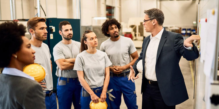 Photo of a supervisor giving training to employees