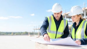 Site manager reviewing drawings on site during CITB SMSTS training