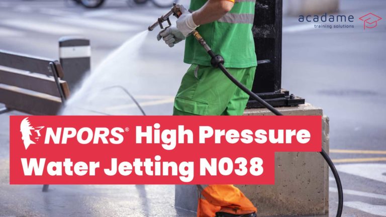 NPORS high pressure water jetting training course image showing an operative using high pressure water jetting equipment for surface cleaning