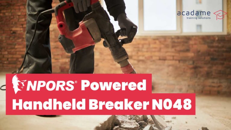 NPORS powered handheld breaker training course image showing an operative using a handheld breaker to break concrete indoors