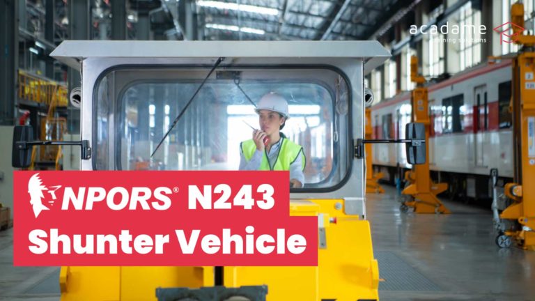 NPORS shunter vehicle training course image showing a shunter vehicle being operated inside an industrial rail or transport maintenance facility